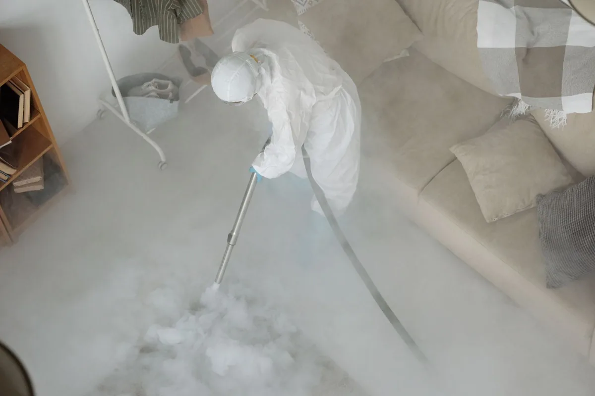 Biohazard cleanup technician in protective equipment, Carnot-Moon, PA